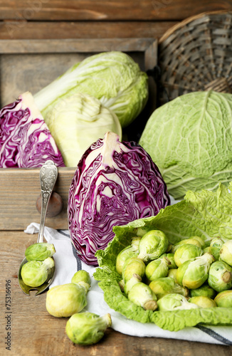 Still life with assortment cabbages on wooden background