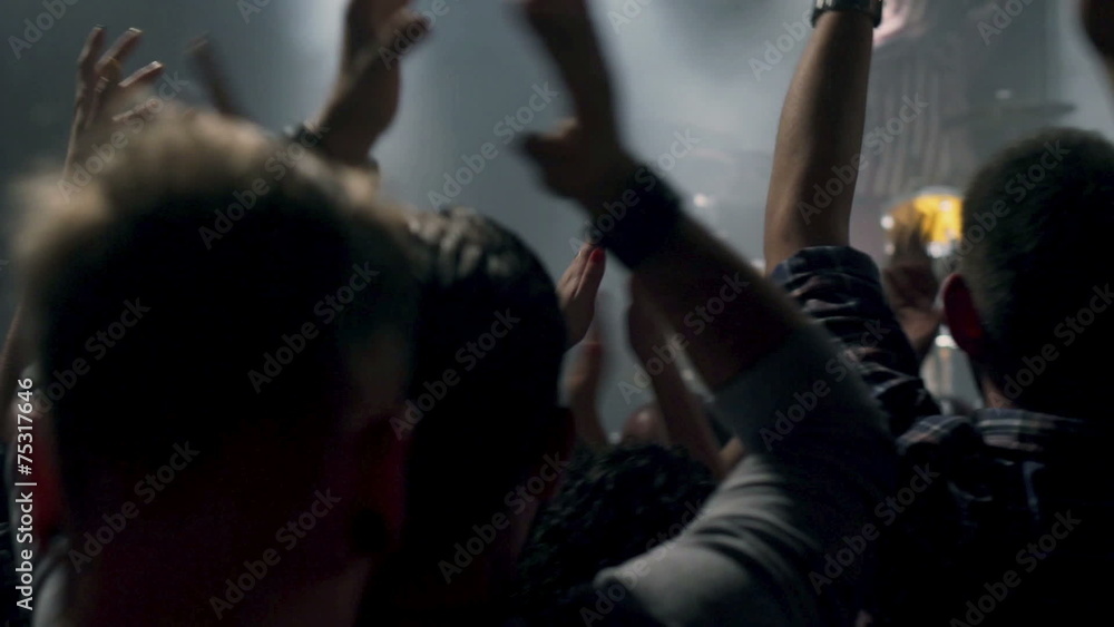 People applaud band at rock concert in the club People applaud band at rock concert in the club
