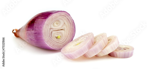 Pieces of echalion onion isolated on white