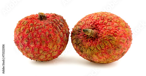 Two lychee fruits isolated on white