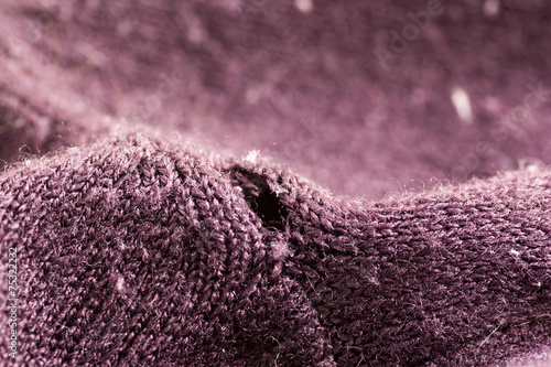 Hole on the purple sweater