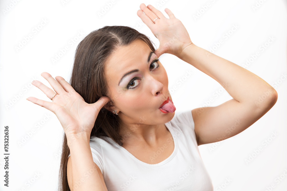 Portrait of brunette grimacing with his tongue hanging out Portrait of brunette grimacing with his tongue hanging out