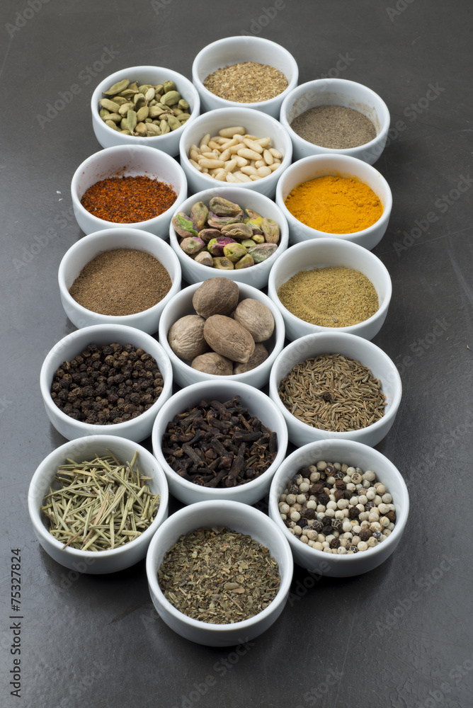 large collection of different spices and herbs isolated on Black large collection of different spices and herbs isolated on Black