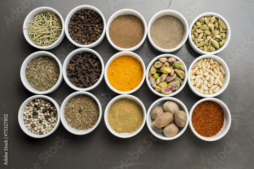 large collection of different spices and herbs isolated on Black