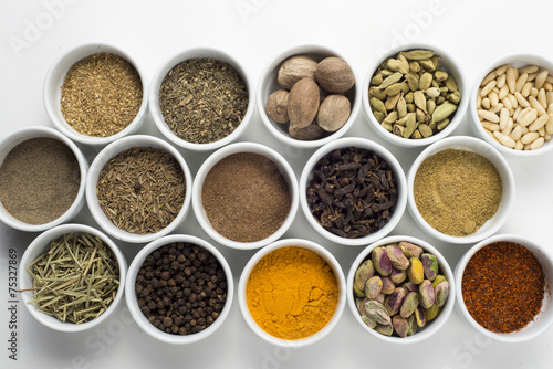 large collection of different spices and herbs isolated on white