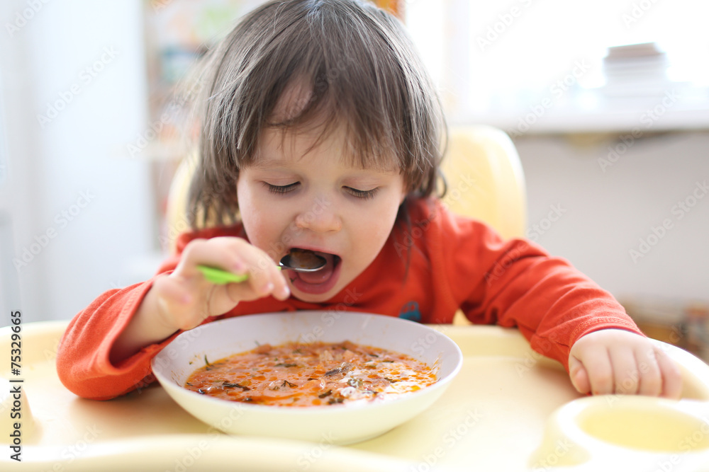2 years boy eating soup red-beet soup 2 years boy eating soup red-beet soup