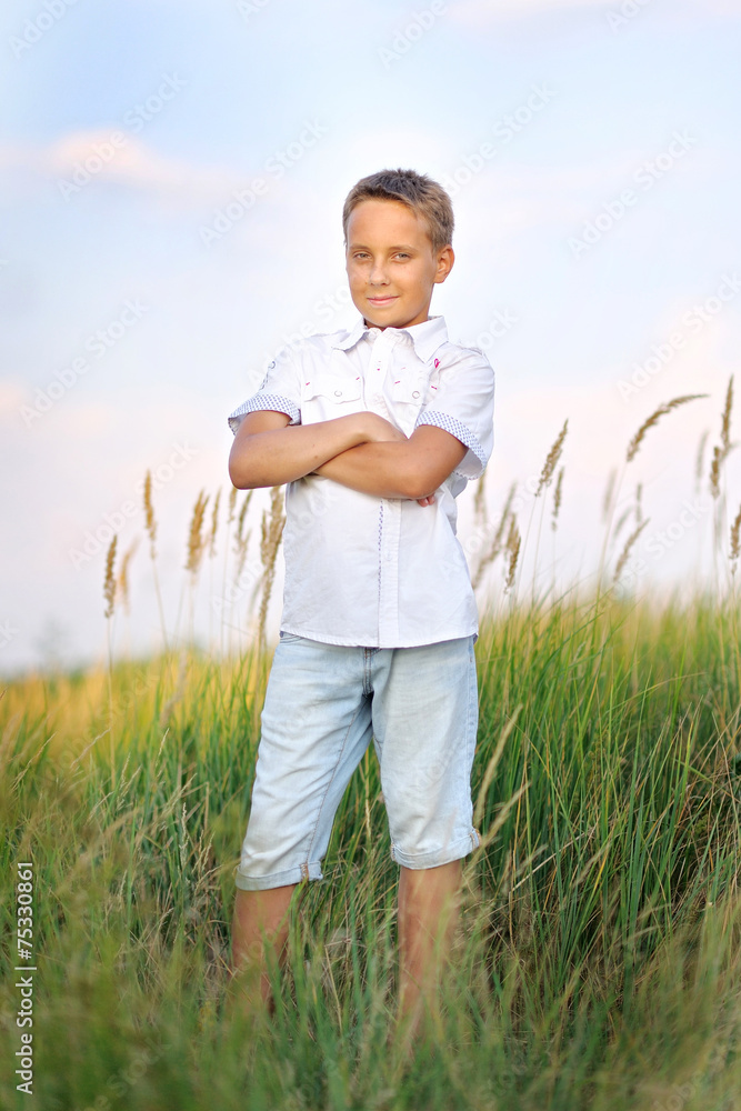 portrait of a little boy on the beach in summer