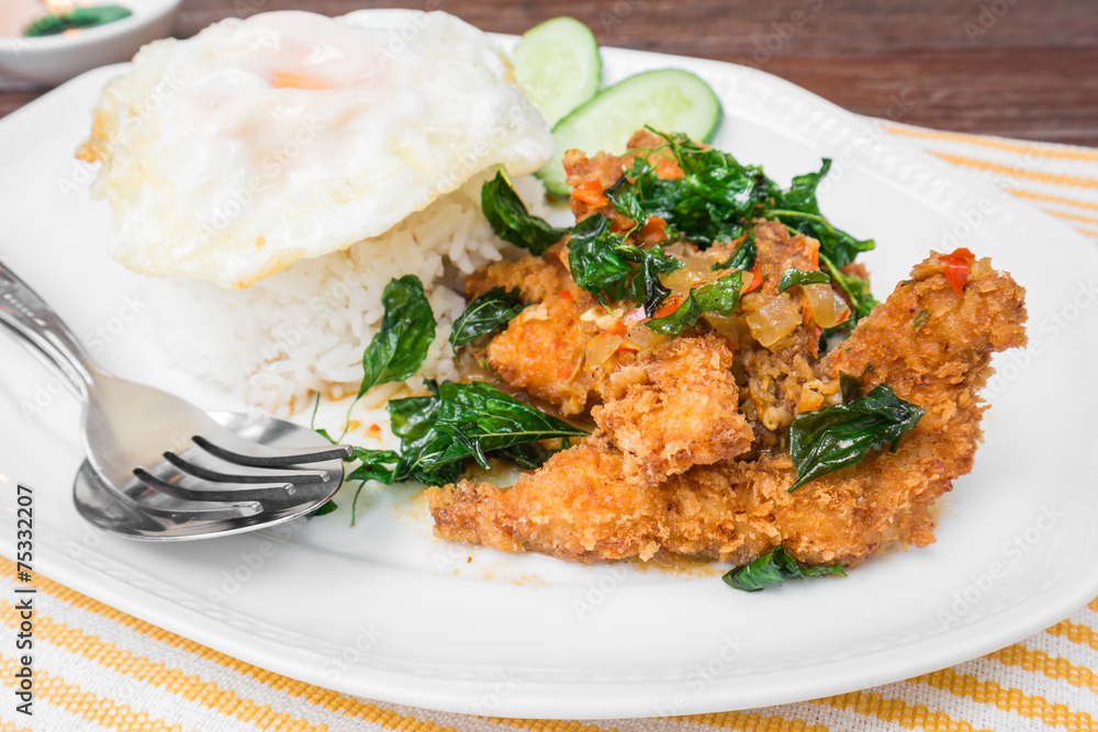 Basil fried rice with crispy chicken and fried egg (Pad kra prao Basil fried rice with crispy chicken and fried egg (Pad kra prao