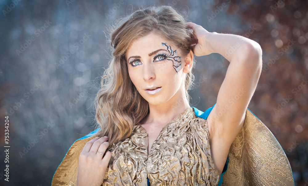 Naklejka premium Lovely young lady in elegant dress posing winter scenery