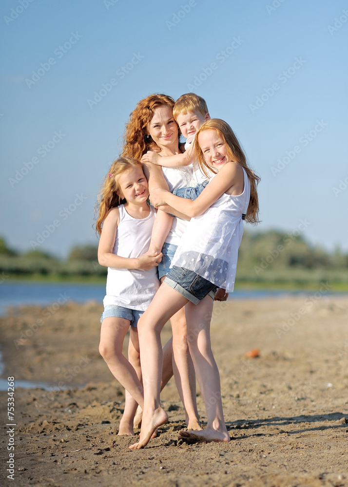 family portrait of mother and of a boy and his two sisters loved