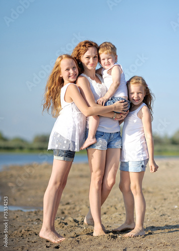 family portrait of mother and of a boy and his two sisters loved
