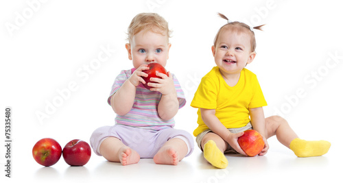 Baby boy and girl eating healthy food isolated
