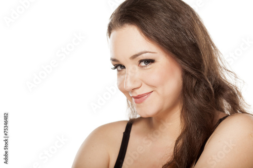 young happy woman with a seductive look on a white background