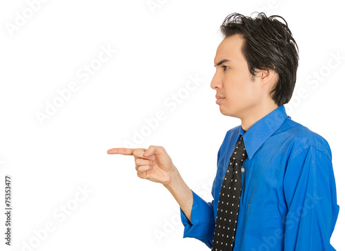 Canvas Print Side profile serious man, pointing with index finger at someone