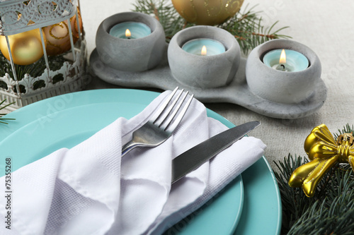 Christmas table setting in blue, golden and whitec olors photo