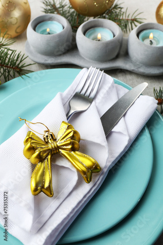 Christmas table setting in blue, golden and whitec olors photo