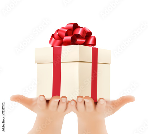Holiday background with hands holding gift boxes. Concept of giv