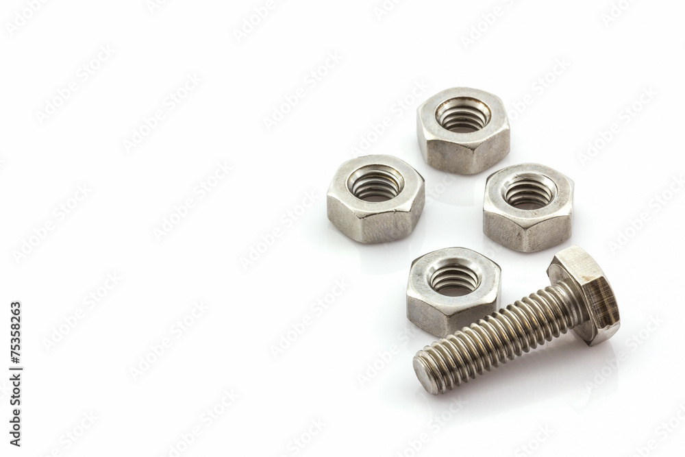 Metal screw and nuts on white background. Metal screw and nuts on white background.