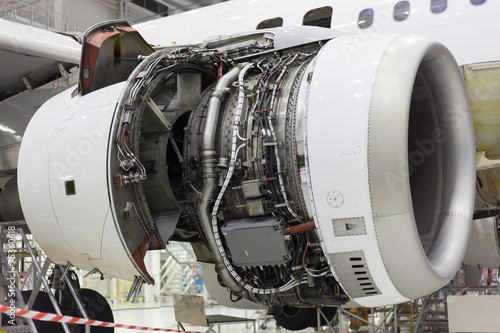 opened aircraft engine in the hangar