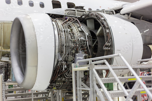 opened aircraft engine in the hangar