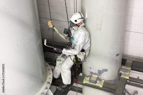 man painting with airbrush