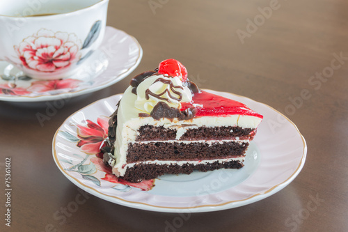 Chocolate cake With Coffee Cup on Wooden Table