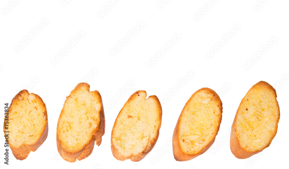Homemade garlic bread of French baguette over white background Homemade garlic bread of French baguette over white background