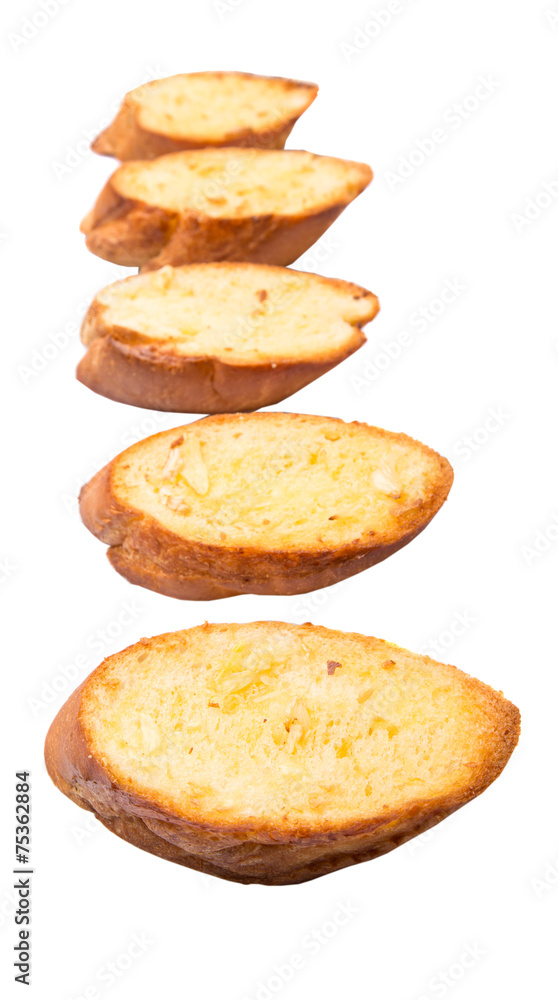 Homemade garlic bread of French baguette over white background Homemade garlic bread of French baguette over white background