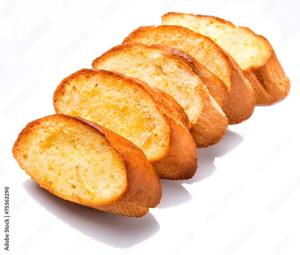Homemade garlic bread of French baguette over white background