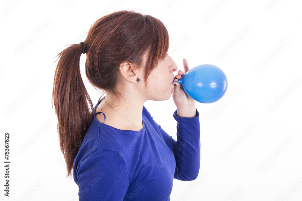 Portrait of young woman blowing balloon Portrait of young woman blowing balloon