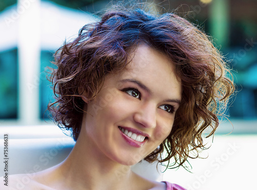 Curly hair young woman portrait