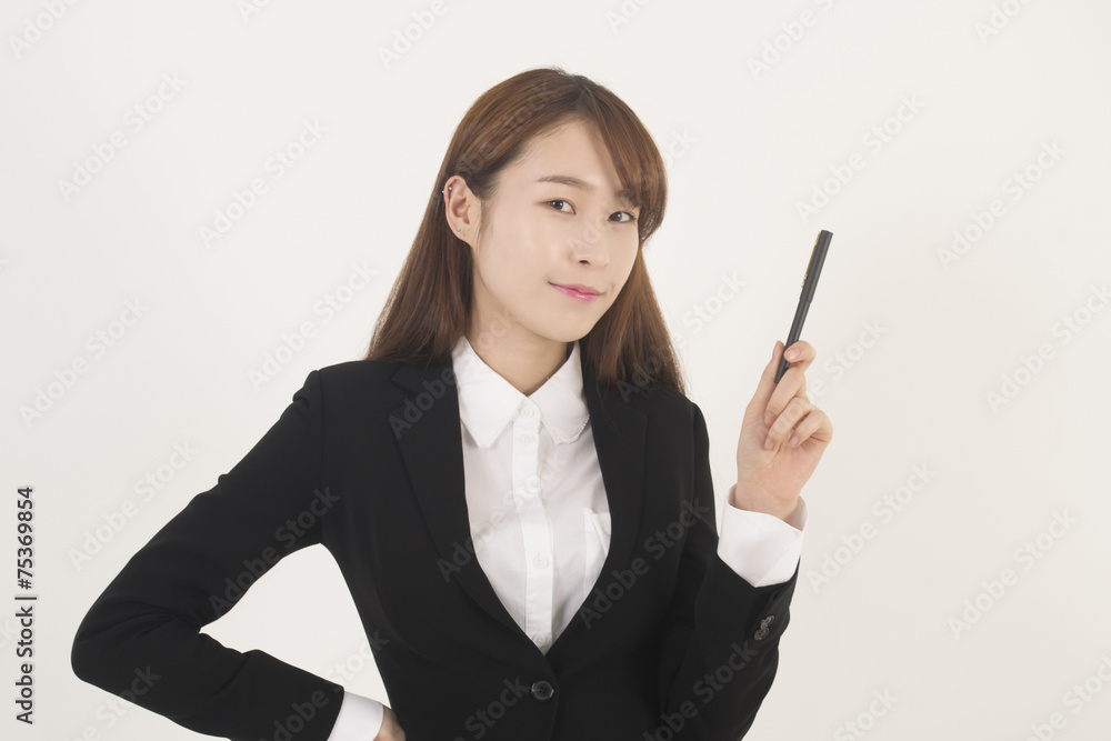 Attractive young asian businesswoman with a pen Attractive young asian businesswoman with a pen