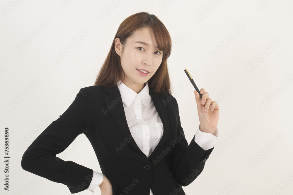 Attractive young asian businesswoman with a pen Attractive young asian businesswoman with a pen
