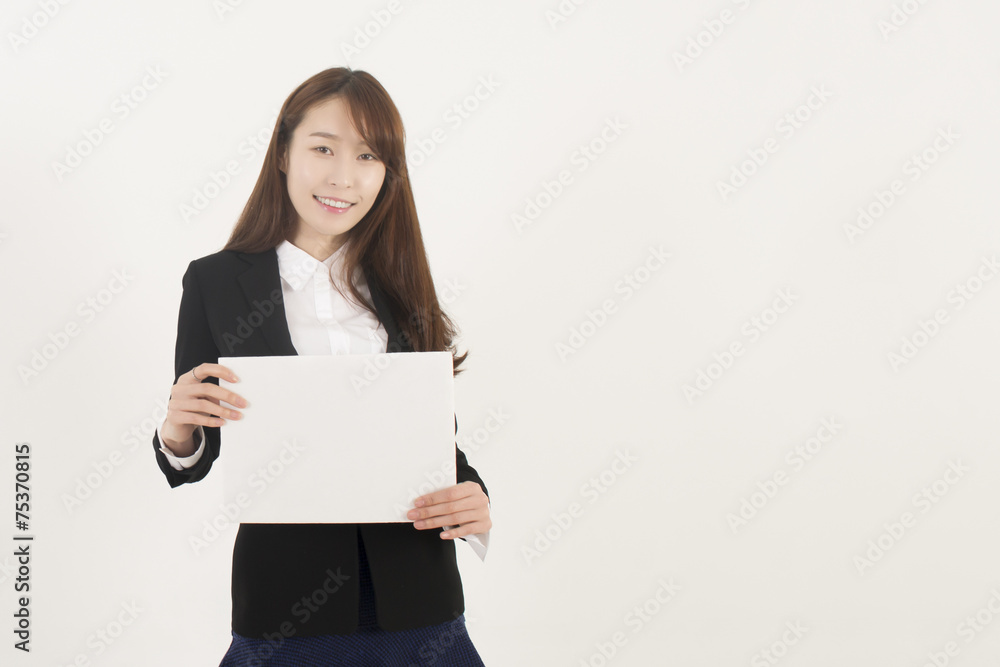 Young Asian Woman Holding a Blank White Sign Young Asian Woman Holding a Blank White Sign