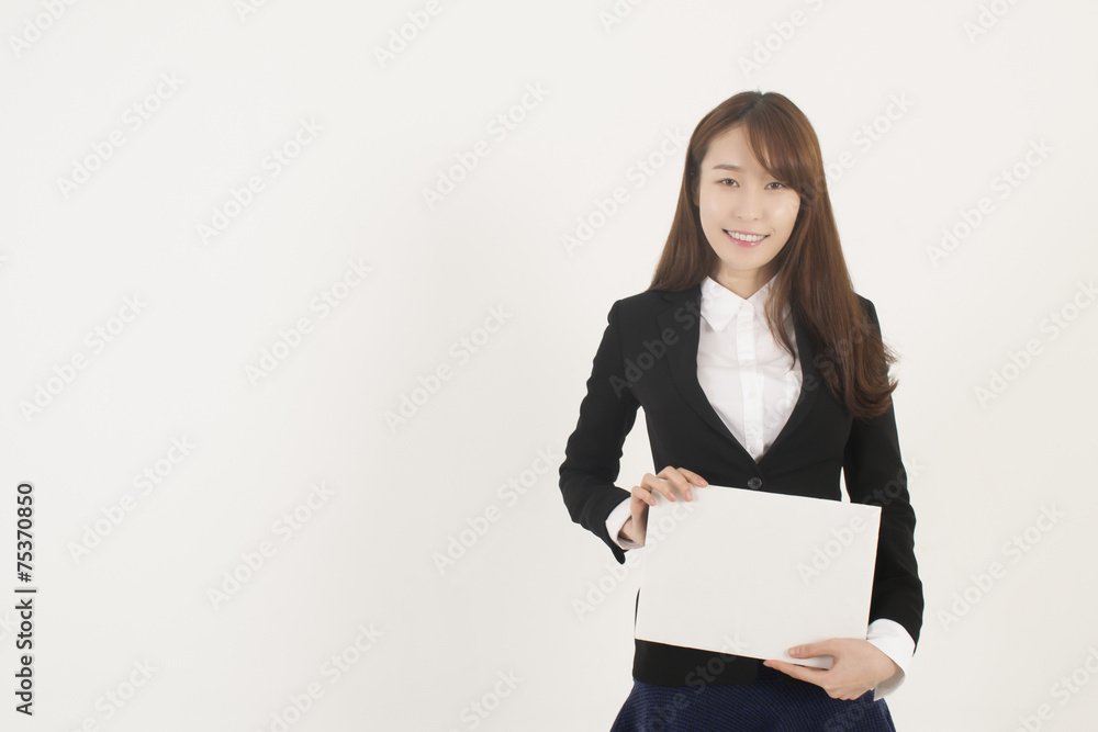 Young Asian Woman Holding a Blank White Sign Young Asian Woman Holding a Blank White Sign