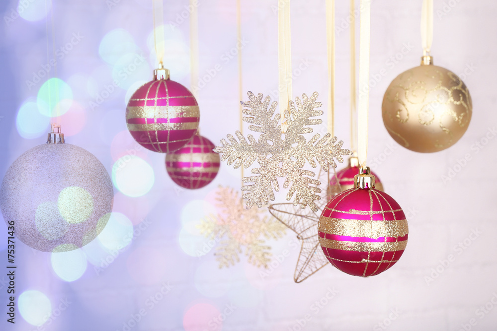 Christmas decorations hanging on festive background Christmas decorations hanging on festive background