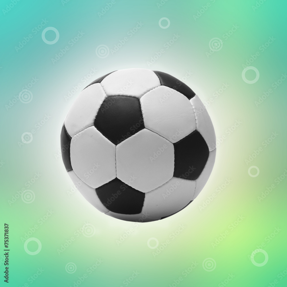 Naklejka premium Football ball on bright green background, sports poster