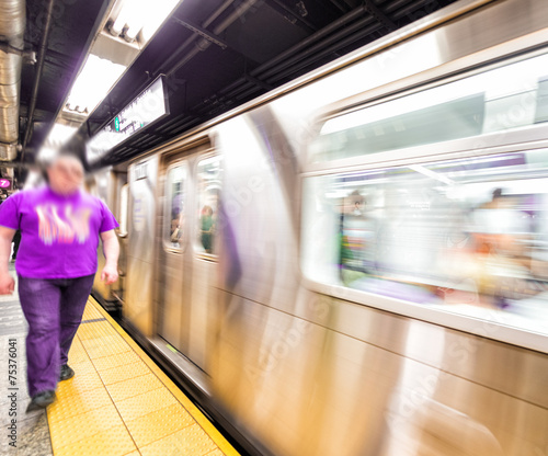 Blurred scene of fast moving subway train in Manhattan subway
