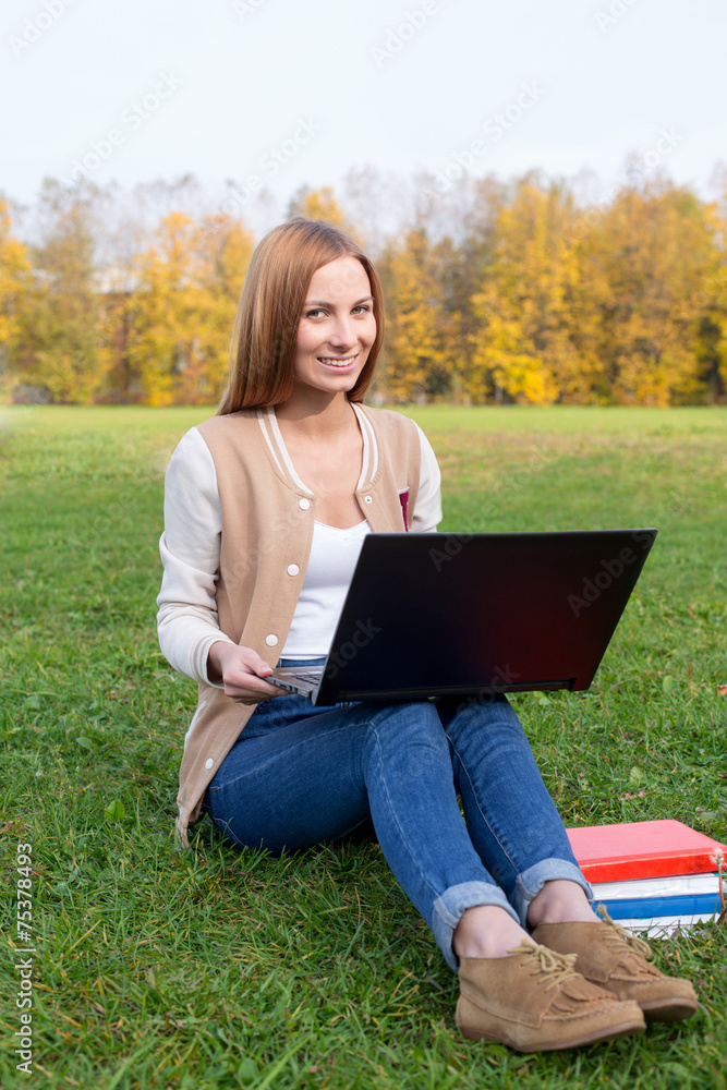 Student sitting on the grass Student sitting on the grass