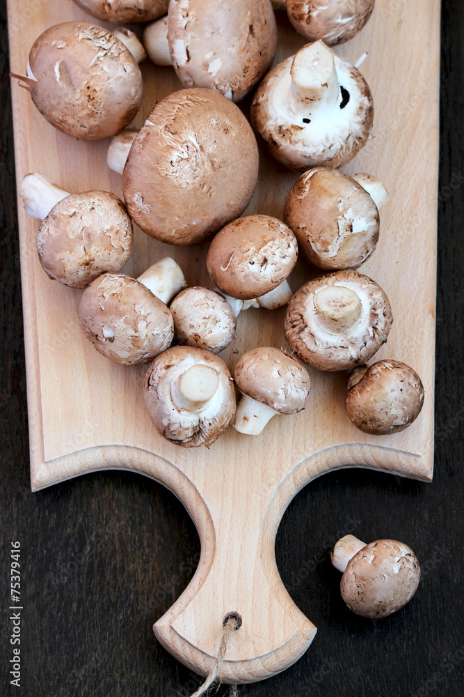 Raw mushrooms with brown hat Raw mushrooms with brown hat