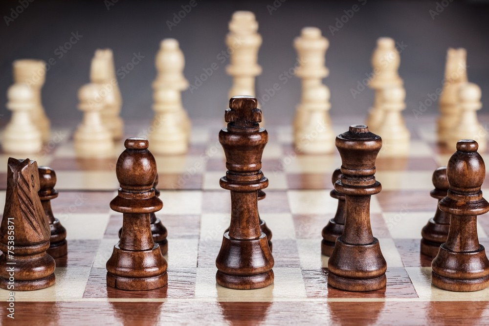 chess board with figures on the wooden table chess board with figures on the wooden table