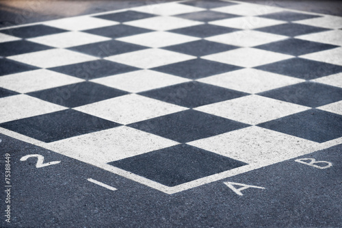 chess board on asphalt