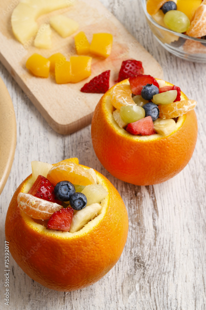 Orange filled with fruit salad