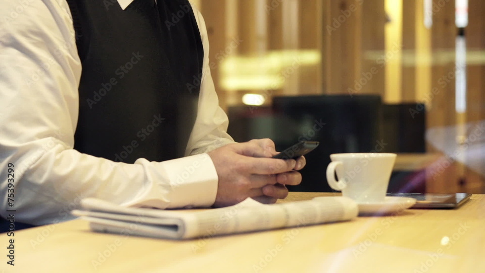 Businessman hands sending sms, texting on smartphone Businessman hands sending sms, texting on smartphone