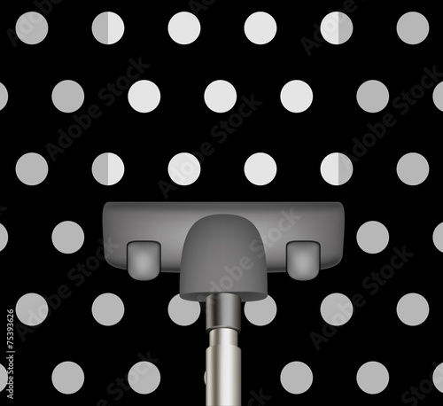 Vacuum cleaner drains black carpet with white dots