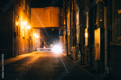 Dark alley at night in Hanover, Pennsylvania. © jonbilous