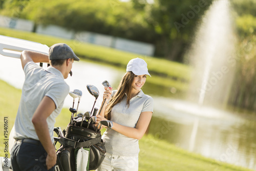 Young couple at golf court