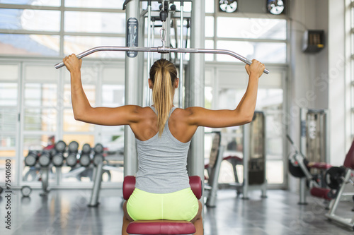 Pretty young woman training...