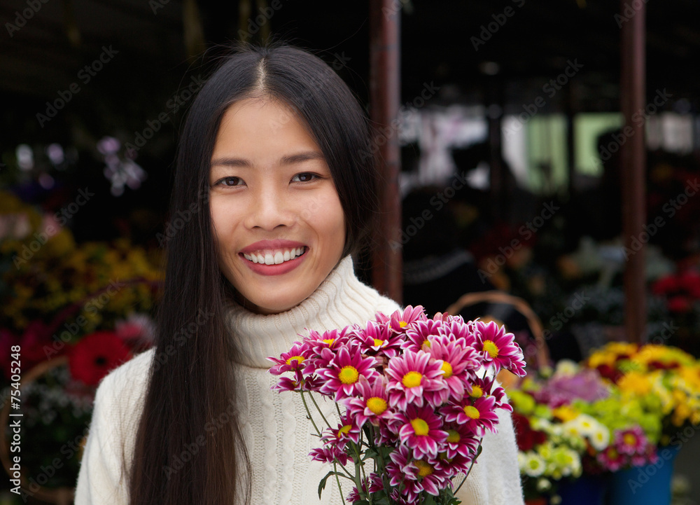 beautiful asian woman smiling with flowers