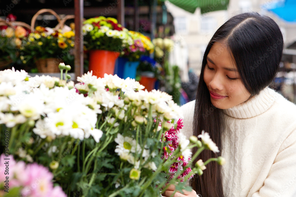 natural young asian woman smiling with white flowers